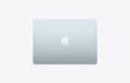 Skyblue Apple MacBook on a light gray background